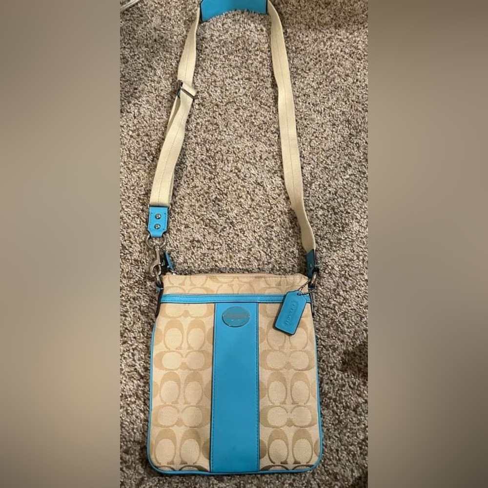 Coach purse. Beige canvas with blue leather. Perfect for a party.